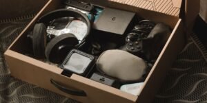 old gadgets in a cardboard box